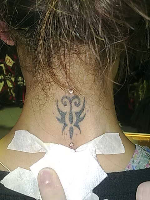 Dermal Anchor in a Tattoo