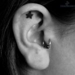 tragus-piercing-and-star-tattoo