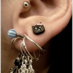tragus-piercing-and-upper-lobe-piercing-with-kitty-stud