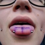 Guy-tongue-piercing-markings