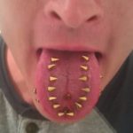 gold-studs-multiple-tongue-piercings